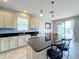 Well-appointed kitchen with stainless appliances, granite countertops, and an island with seating at 3857 San Isidro Cir, St Cloud, FL 34772