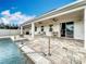 A gorgeous pool with a brick-paved pool deck and covered patio complete with ceiling fans at 3857 San Isidro Cir, St Cloud, FL 34772