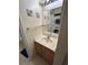 Bathroom featuring a vanity, mirror, and stackable washer/dryer reflected in the mirror at 4010 San Gallo Dr # 105, Kissimmee, FL 34741