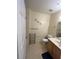 Full bathroom featuring neutral colors, white tile flooring, and modern fixtures at 4010 San Gallo Dr # 105, Kissimmee, FL 34741