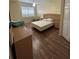 Bedroom featuring a large window, wood flooring, and a ceiling fan at 4010 San Gallo Dr # 105, Kissimmee, FL 34741