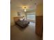 Bedroom with carpet, a ceiling fan, and a queen bed with bedside tables at 4010 San Gallo Dr # 105, Kissimmee, FL 34741