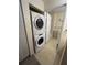 Stackable washer and dryer setup located near bathroom at 4010 San Gallo Dr # 105, Kissimmee, FL 34741