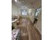 Inviting living room with hardwood floors and a large window at 4010 San Gallo Dr # 105, Kissimmee, FL 34741