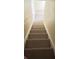 Staircase with carpeted steps at 4010 San Gallo Dr # 105, Kissimmee, FL 34741