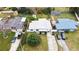 This is an aerial view of the home, its driveway and lawn and the neighboring houses at 4126 Montrose Ct, Orlando, FL 32812