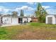 Large backyard featuring a shed and a patio with outdoor seating at 4126 Montrose Ct, Orlando, FL 32812