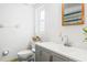 Clean and bright bathroom featuring a modern sink and vanity and toilet at 4126 Montrose Ct, Orlando, FL 32812