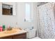 Bathroom with tub and shower, toilet and single sink vanity at 4126 Montrose Ct, Orlando, FL 32812