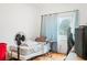 Bedroom with wood floor, window and bed at 4126 Montrose Ct, Orlando, FL 32812