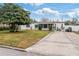 Charming single-story home with well-maintained lawn and a long driveway at 4126 Montrose Ct, Orlando, FL 32812