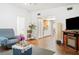 Inviting living room with hardwood floors and an open view to the kitchen at 4126 Montrose Ct, Orlando, FL 32812