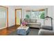 Bright living room featuring hardwood floors and a large window at 4126 Montrose Ct, Orlando, FL 32812