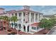 A three-story cafe building on a brick corner lot features outside terraces and vibrant landscaping at 440 Water St # 440, Celebration, FL 34747