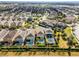 Aerial view of home and neighboring properties with in-ground pools at 561 Lasso Dr, Kissimmee, FL 34747