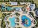 Overhead shot of a resort's waterpark area with colorful slides and inviting pools at 561 Lasso Dr, Kissimmee, FL 34747
