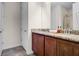 Bathroom featuring double vanity with granite countertops and wood cabinets at 561 Lasso Dr, Kissimmee, FL 34747