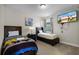 Bright bedroom with two twin beds, a TV, and a window for natural light at 561 Lasso Dr, Kissimmee, FL 34747