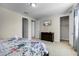 Bedroom with a queen bed, dresser, TV, and closet for ample storage at 561 Lasso Dr, Kissimmee, FL 34747