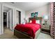 Comfortable bedroom with a queen bed, modern decor, and a closet at 561 Lasso Dr, Kissimmee, FL 34747