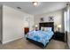 Charming bedroom with a cozy queen bed, bedside tables, and ensuite bathroom at 561 Lasso Dr, Kissimmee, FL 34747