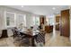 Open dining area with stylish chairs, connecting the kitchen to the living room at 561 Lasso Dr, Kissimmee, FL 34747