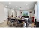 Open dining area with stylish chairs, connecting the kitchen to the living room at 561 Lasso Dr, Kissimmee, FL 34747