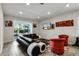Modern living room with plush seating and sliding glass doors to outdoor at 561 Lasso Dr, Kissimmee, FL 34747
