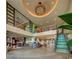 Spacious lobby with modern design, comfortable seating and staircase to a second story at 561 Lasso Dr, Kissimmee, FL 34747