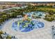 Aerial view of community splash zone, featuring slides and splash zones for Gathering fun at 561 Lasso Dr, Kissimmee, FL 34747