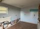 Interior view of an unfinished room, featuring exposed pipes and walls ready for renovation at 608 S Lakeview Ave, Winter Garden, FL 34787