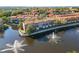 These luxurious townhomes surround a serene pond with lovely water features, nestled within a thriving community at 6109 Metrowest Blvd # 105, Orlando, FL 32835