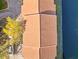 Aerial view of condo complex showing the terracotta roof, landscaping and water feature at 6109 Metrowest Blvd # 105, Orlando, FL 32835