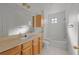 Bathroom with a vanity, sink, toilet, and shower-tub combination at 6109 Metrowest Blvd # 105, Orlando, FL 32835