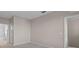 Neutral bedroom with access to an ensuite bathroom and ample natural light at 6109 Metrowest Blvd # 105, Orlando, FL 32835