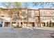 Charming townhome with a stucco exterior, stone accents, and attached garages at 6109 Metrowest Blvd # 105, Orlando, FL 32835