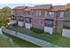 These waterfront townhomes boast stucco siding, tile roofs, and private balconies offering tranquil views at 6109 Metrowest Blvd # 105, Orlando, FL 32835