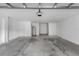 Clean and well-lit two car garage with plenty of space for parking and storage at 6109 Metrowest Blvd # 105, Orlando, FL 32835