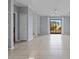 Open living room with tile floors, a fan, and lots of natural light at 6109 Metrowest Blvd # 105, Orlando, FL 32835
