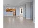 Open-concept living room showcasing a spacious layout, tile flooring, and a view into the kitchen at 6109 Metrowest Blvd # 105, Orlando, FL 32835