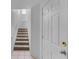 Bright entryway staircase with tiled floors and landing at 6109 Metrowest Blvd # 105, Orlando, FL 32835