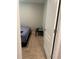 Small bedroom with a single bed, simple furnishings, and a view of the doorway at 735 Chinoy Rd, Davenport, FL 33837