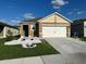 Charming one story home with a well manicured lawn and a two car garage at 735 Chinoy Rd, Davenport, FL 33837