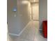 Tiled hallway with access to bedrooms, bathrooms, and living spaces at 735 Chinoy Rd, Davenport, FL 33837