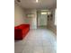 Hallway featuring tile floors and access to the front door and living areas at 735 Chinoy Rd, Davenport, FL 33837
