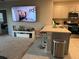 Living room featuring tile floors and an open view to the kitchen with seating at 735 Chinoy Rd, Davenport, FL 33837