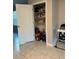 Walk-in pantry with ample shelving stocked with various food and beverage items at 735 Chinoy Rd, Davenport, FL 33837