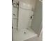 Standing shower stall with shelves, and a built in soap holder at 735 Chinoy Rd, Davenport, FL 33837