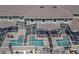 Aerial view of multiple screened-in pools and patios in a backyard at 750 Pebble Beach Dr, Davenport, FL 33896