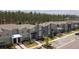 Community shot displaying townhomes with private parking and green spaces at 750 Pebble Beach Dr, Davenport, FL 33896